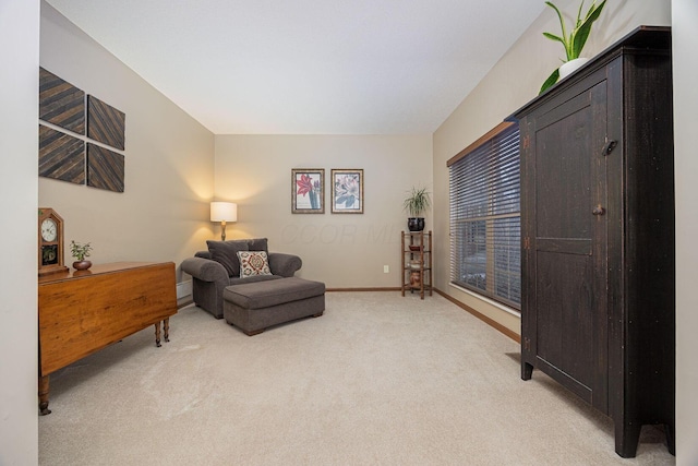 living area featuring light colored carpet