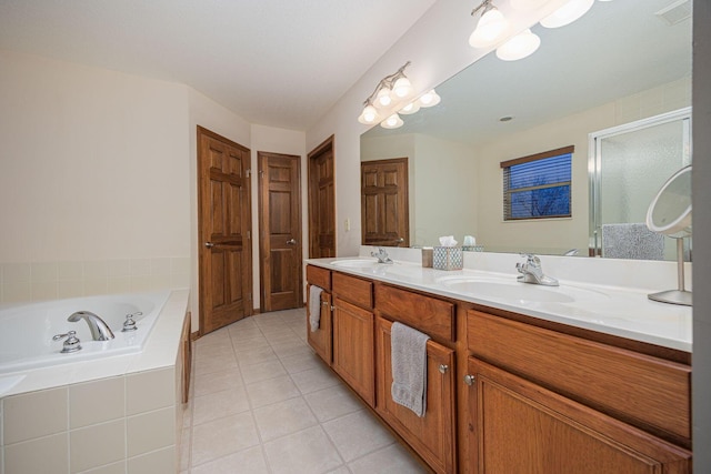 bathroom featuring vanity, tile patterned flooring, and shower with separate bathtub