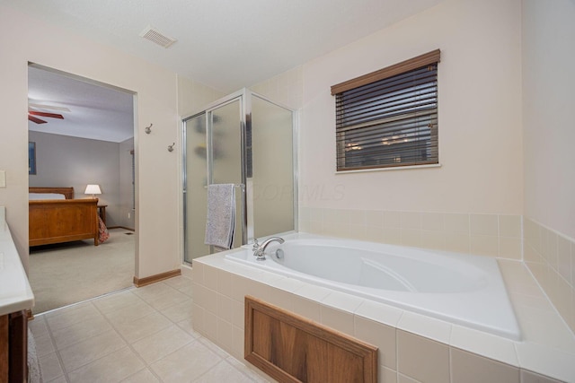 bathroom featuring tile patterned floors, plus walk in shower, and a textured ceiling