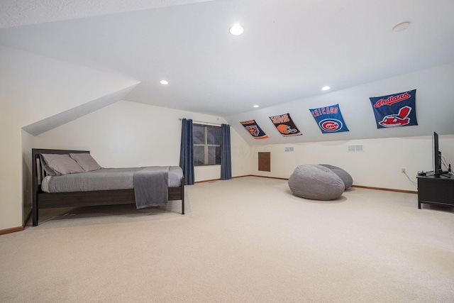 bedroom featuring carpet floors and vaulted ceiling