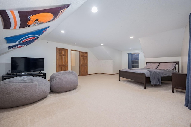 carpeted bedroom featuring vaulted ceiling