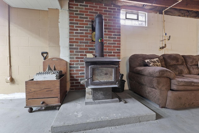 interior details with concrete flooring and a wood stove