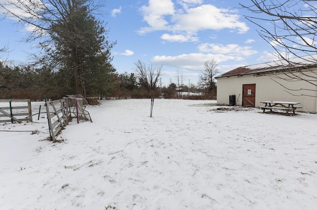 view of yard layered in snow