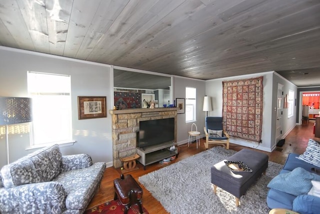 living room with hardwood / wood-style flooring, crown molding, and wooden ceiling