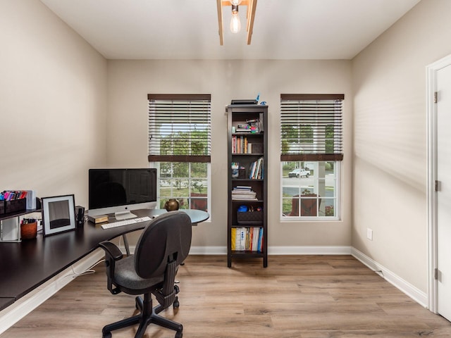 home office with light wood-type flooring