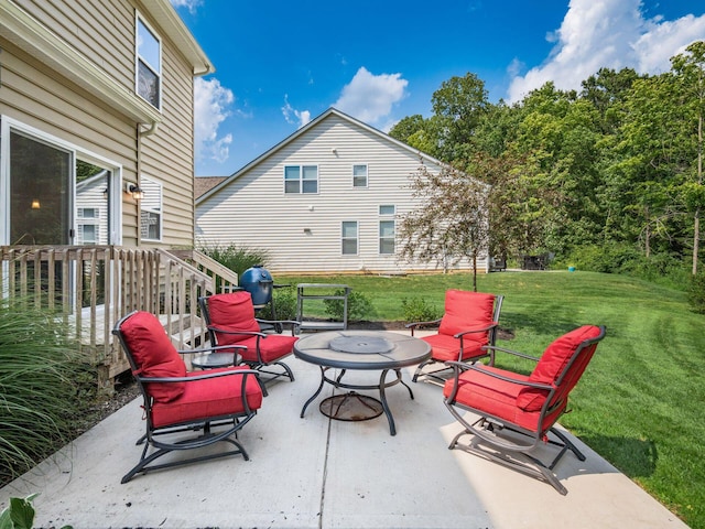 view of patio / terrace featuring an outdoor fire pit