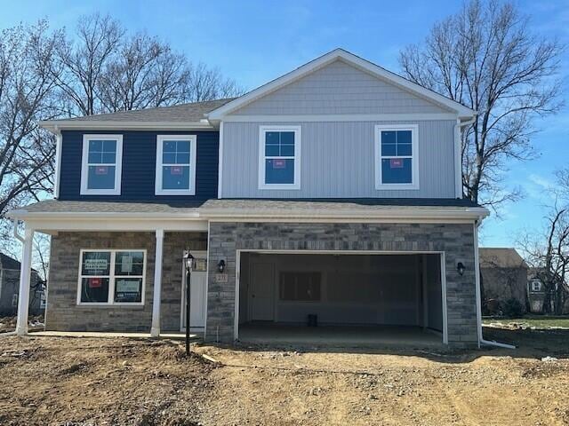 view of front of property featuring a garage