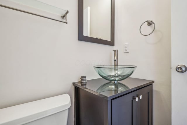 bathroom with vanity and toilet