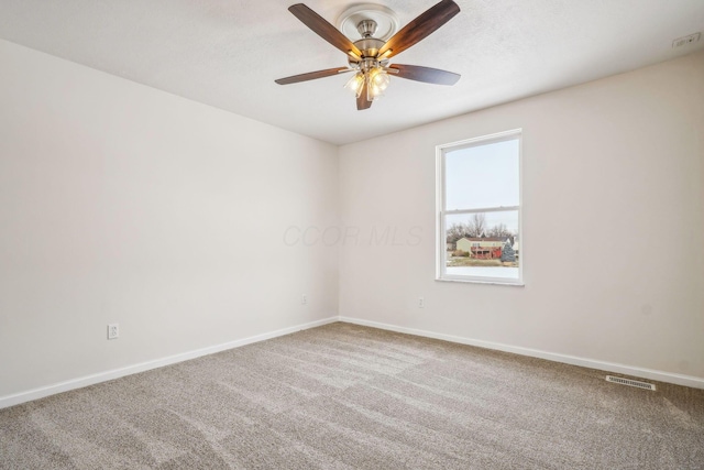 empty room with carpet and ceiling fan