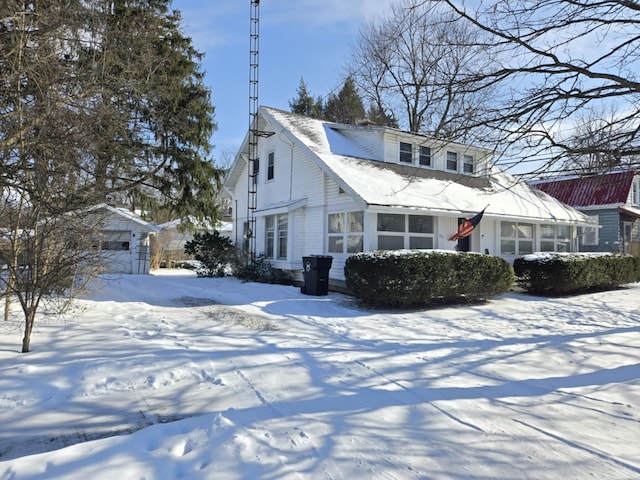 view of front of home with an outdoor structure and a garage