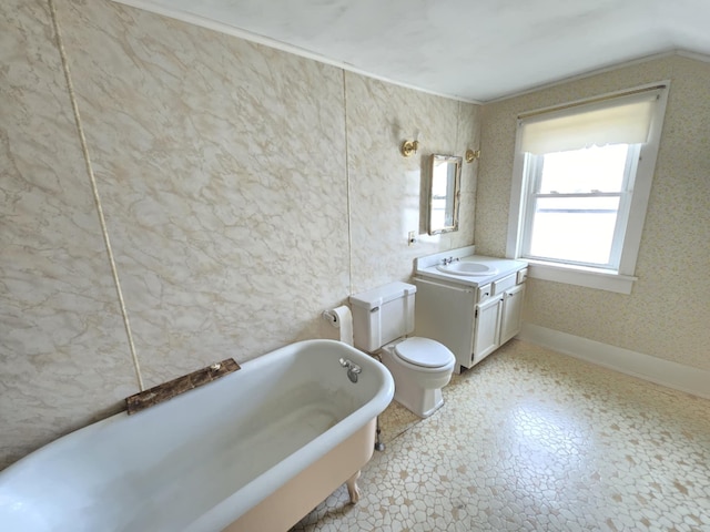 215 S Jefferson St, Galion, OH 44833 - bathroom with vanity, a soaking tub, toilet, and baseboards