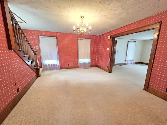 215 S Jefferson St, Galion, OH 44833 - interior space featuring an inviting chandelier, carpet flooring, wallpapered walls, baseboards, and stairs