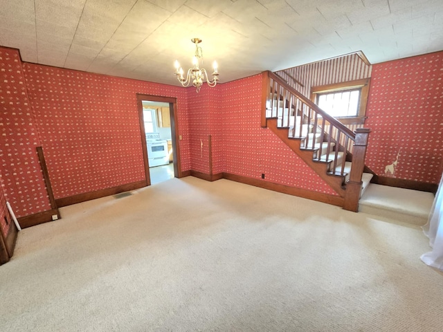 215 S Jefferson St, Galion, OH 44833 - interior space with visible vents, wallpapered walls, carpet, stairs, and an inviting chandelier