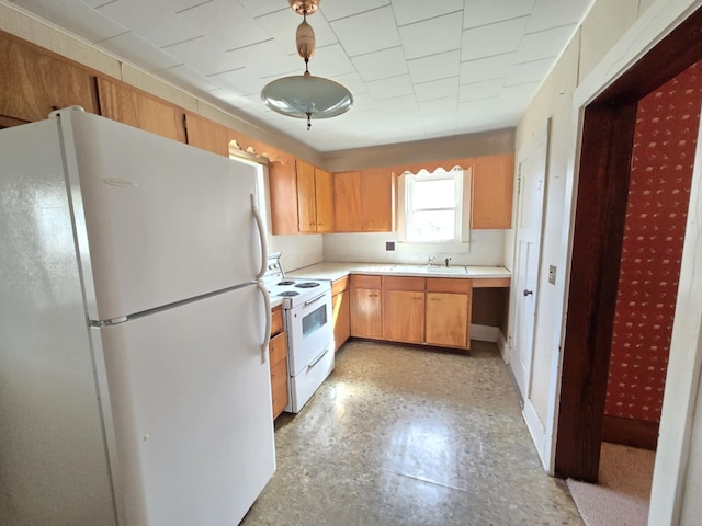 215 S Jefferson St, Galion, OH 44833 - kitchen featuring white appliances, light countertops, light floors, and a sink