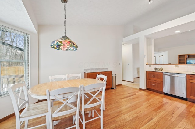 dining area with light hardwood / wood-style flooring