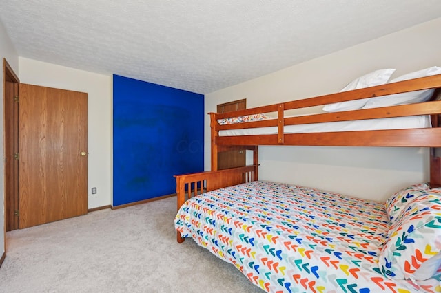 carpeted bedroom with a textured ceiling