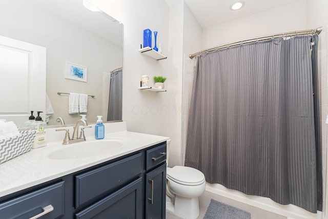 bathroom with vanity, tile patterned flooring, a shower with curtain, and toilet