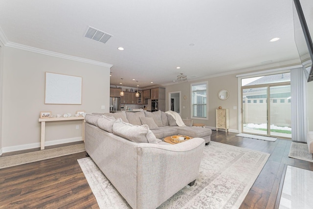 living room with crown molding and dark hardwood / wood-style flooring