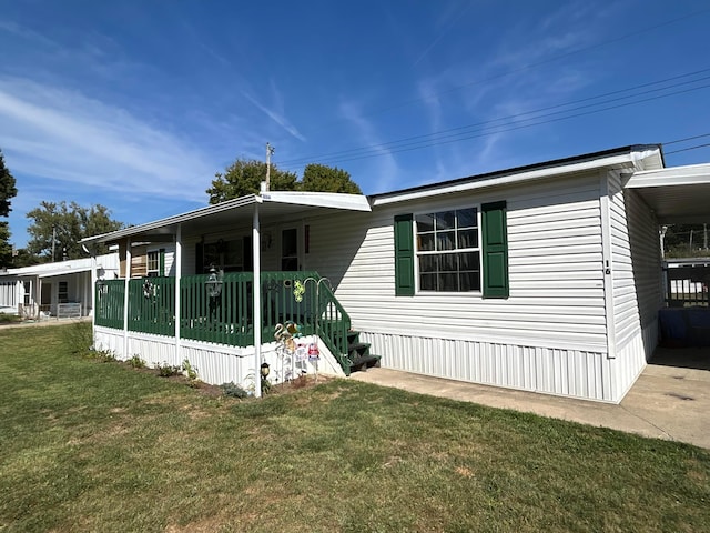 exterior space featuring a porch and a lawn