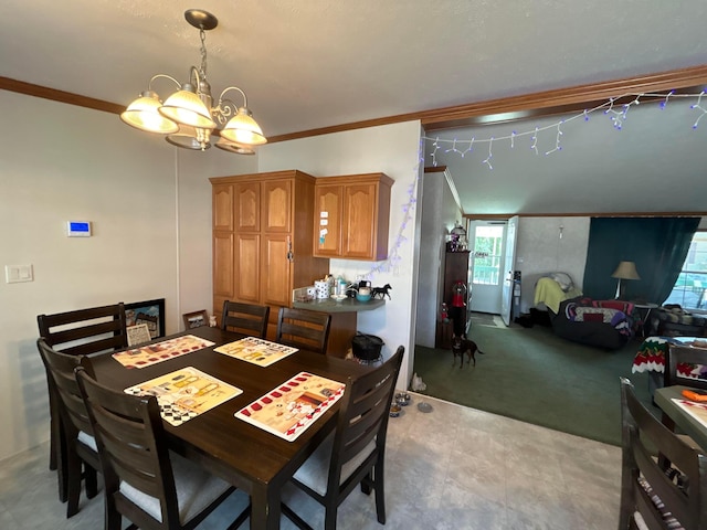 dining space with crown molding, a chandelier, and light carpet