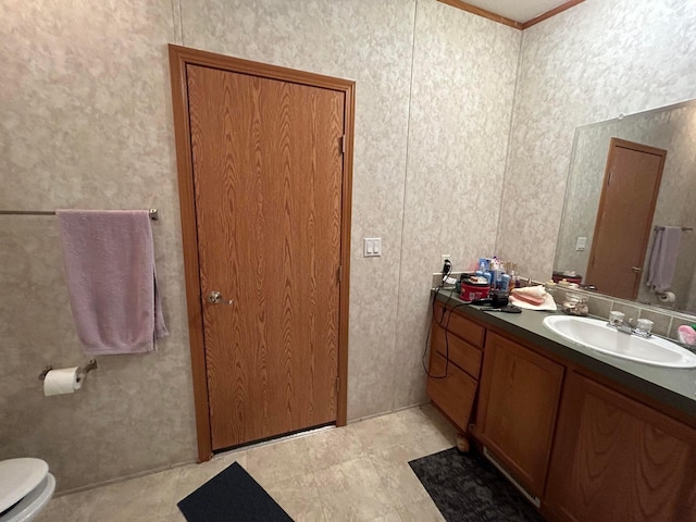 bathroom featuring vanity and toilet