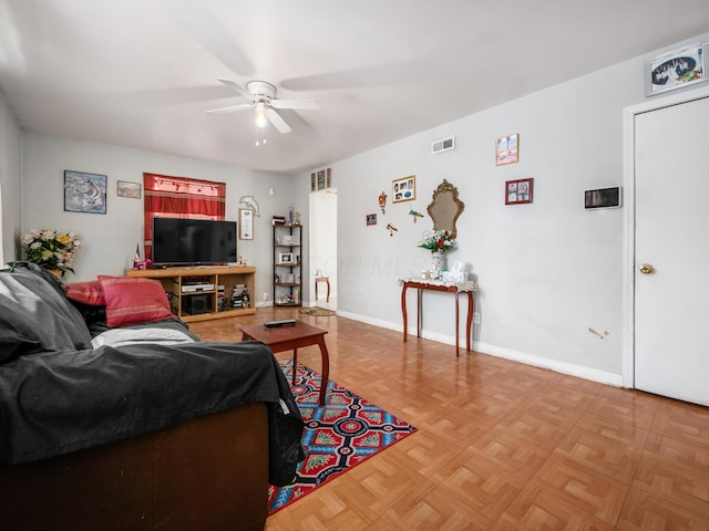 living room with parquet floors and ceiling fan