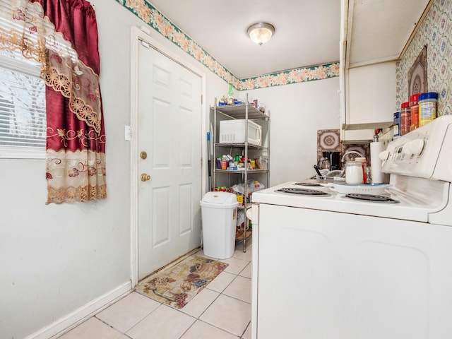 laundry room featuring light tile patterned floors