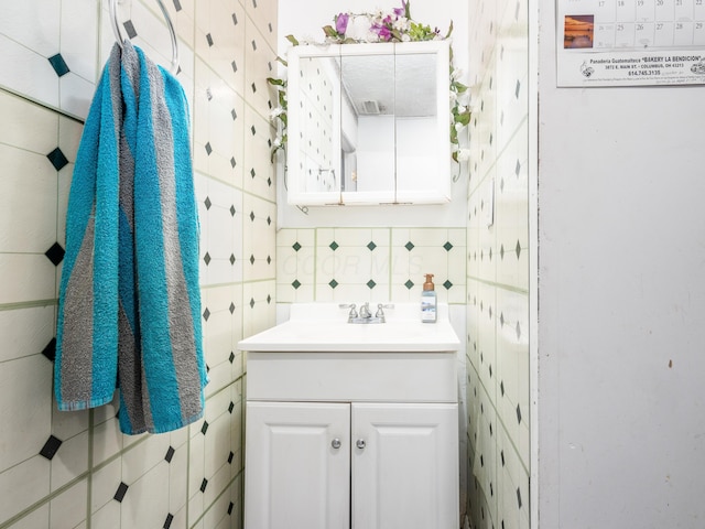 bathroom featuring decorative backsplash and vanity