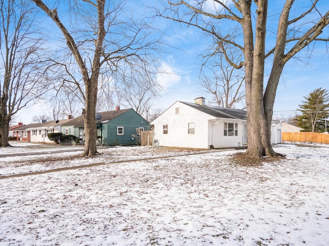 view of snow covered property