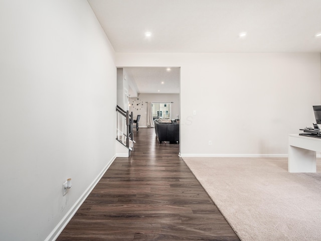 hallway with dark hardwood / wood-style flooring