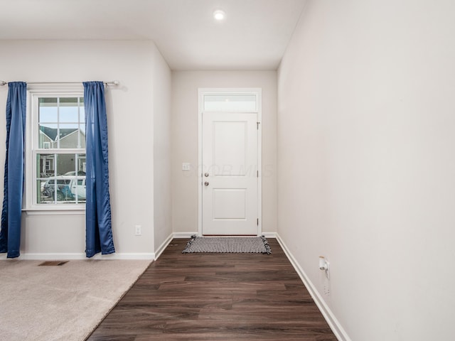 doorway to outside with dark wood-type flooring