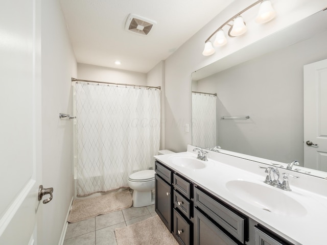 full bathroom featuring shower / bath combo with shower curtain, toilet, tile patterned floors, and vanity