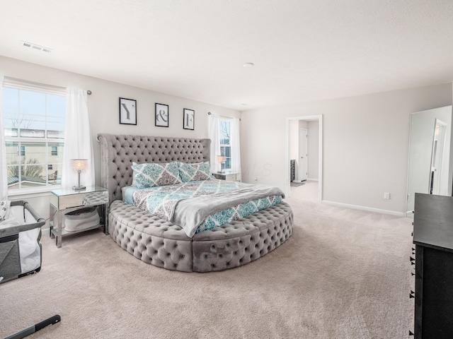 bedroom featuring light colored carpet