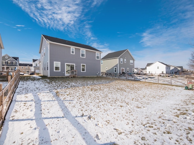 view of snow covered house