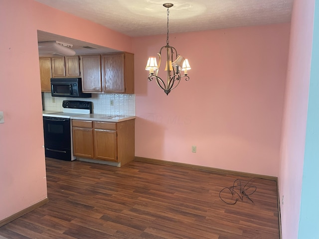 kitchen featuring a textured ceiling, hanging light fixtures, decorative backsplash, dark hardwood / wood-style floors, and range with electric stovetop