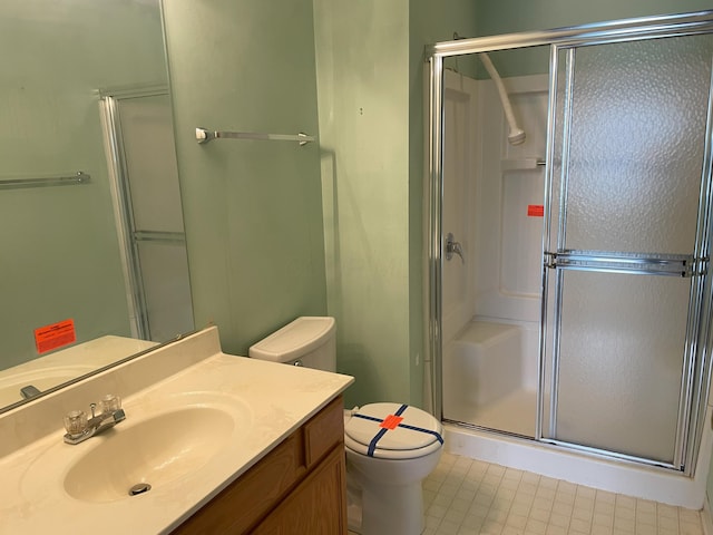 bathroom with vanity, toilet, and walk in shower