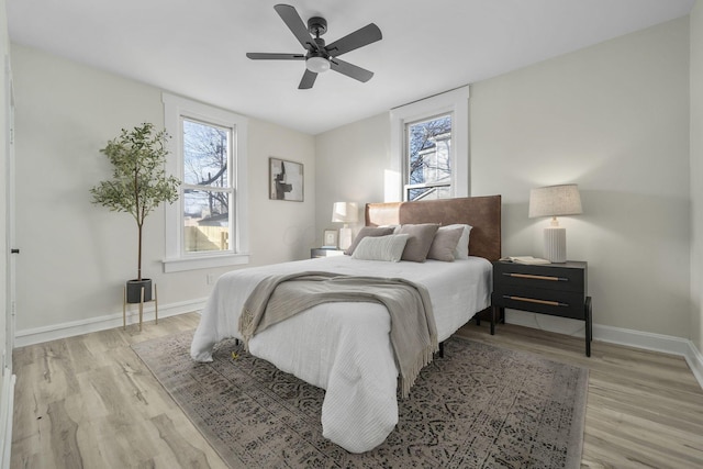 bedroom featuring ceiling fan and light hardwood / wood-style floors