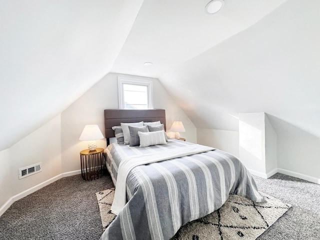 carpeted bedroom featuring vaulted ceiling