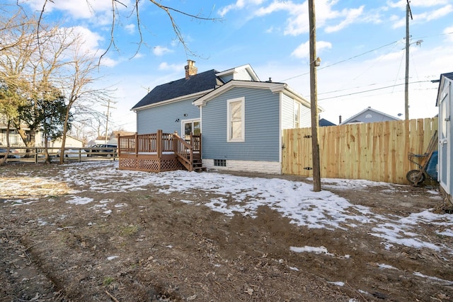 snow covered property featuring a deck