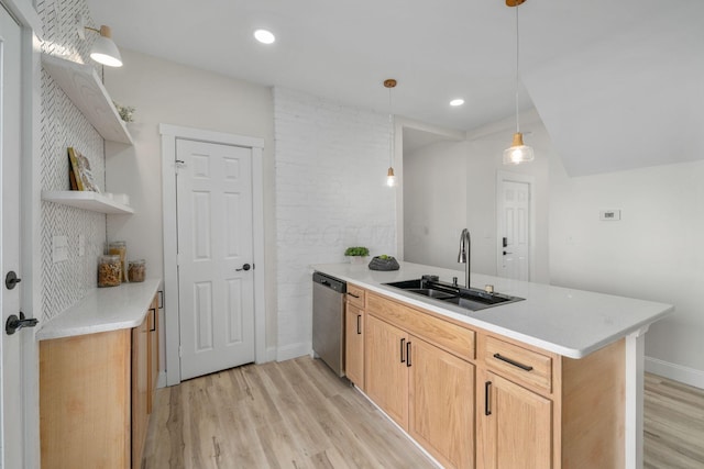 kitchen featuring sink, light brown cabinets, kitchen peninsula, dishwasher, and pendant lighting