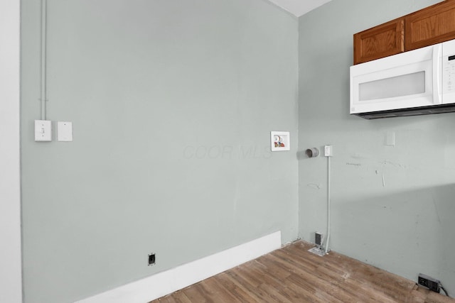 laundry area featuring light hardwood / wood-style flooring and hookup for a washing machine