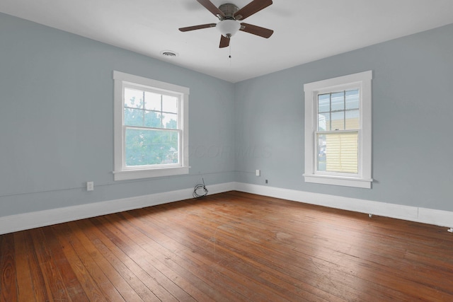 unfurnished room with hardwood / wood-style flooring and ceiling fan