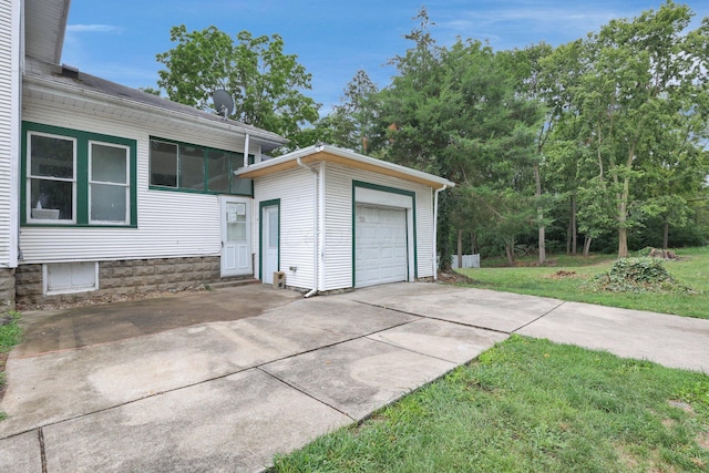 garage featuring a lawn