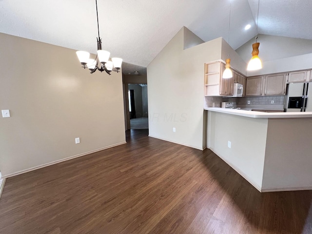 kitchen featuring dark hardwood / wood-style floors, pendant lighting, tasteful backsplash, refrigerator with ice dispenser, and a notable chandelier