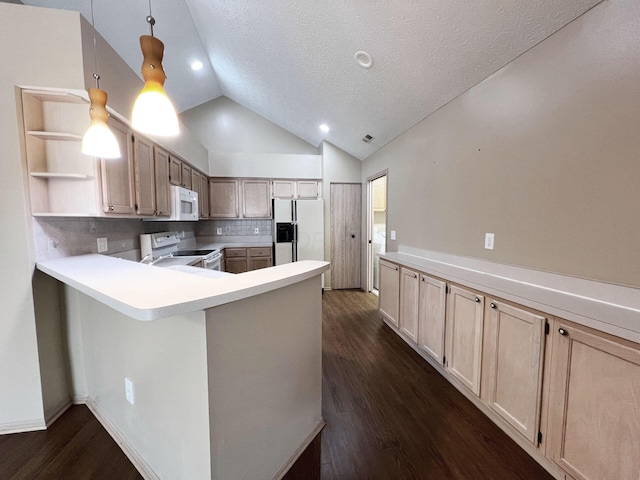 kitchen featuring white appliances, decorative light fixtures, kitchen peninsula, and light brown cabinets