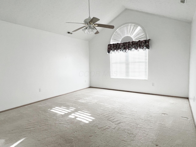 unfurnished room featuring ceiling fan, high vaulted ceiling, and carpet floors