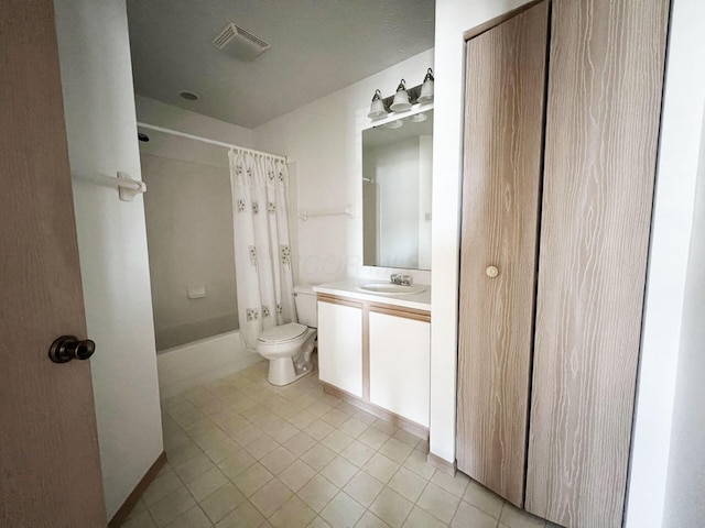 full bathroom with tile patterned floors, vanity, toilet, and shower / tub combo