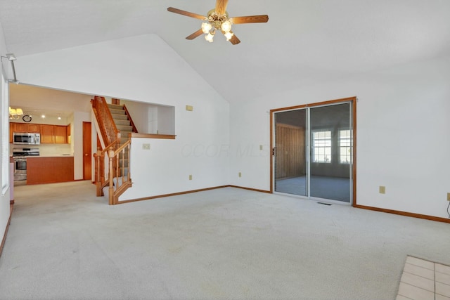 unfurnished living room with light colored carpet, high vaulted ceiling, and ceiling fan