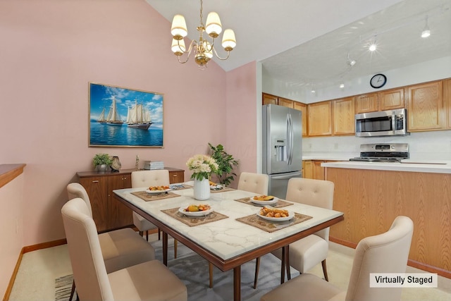 dining room featuring lofted ceiling and a chandelier