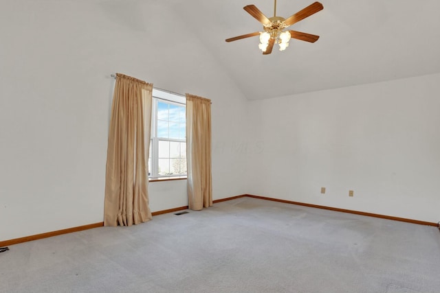 empty room with light carpet, high vaulted ceiling, and ceiling fan